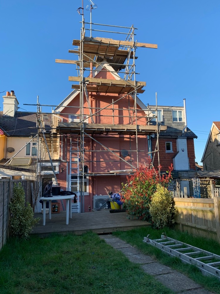 New grey tile-hung cladding and roofline completed by Brandals